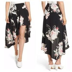 Asymmetrical mid length skirt with side zipper